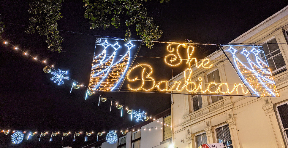 Christmas lights on Southside Street in Plymouth, spelling out The Barbican 
